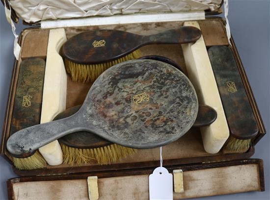 A tortoiseshell mounted toilet set